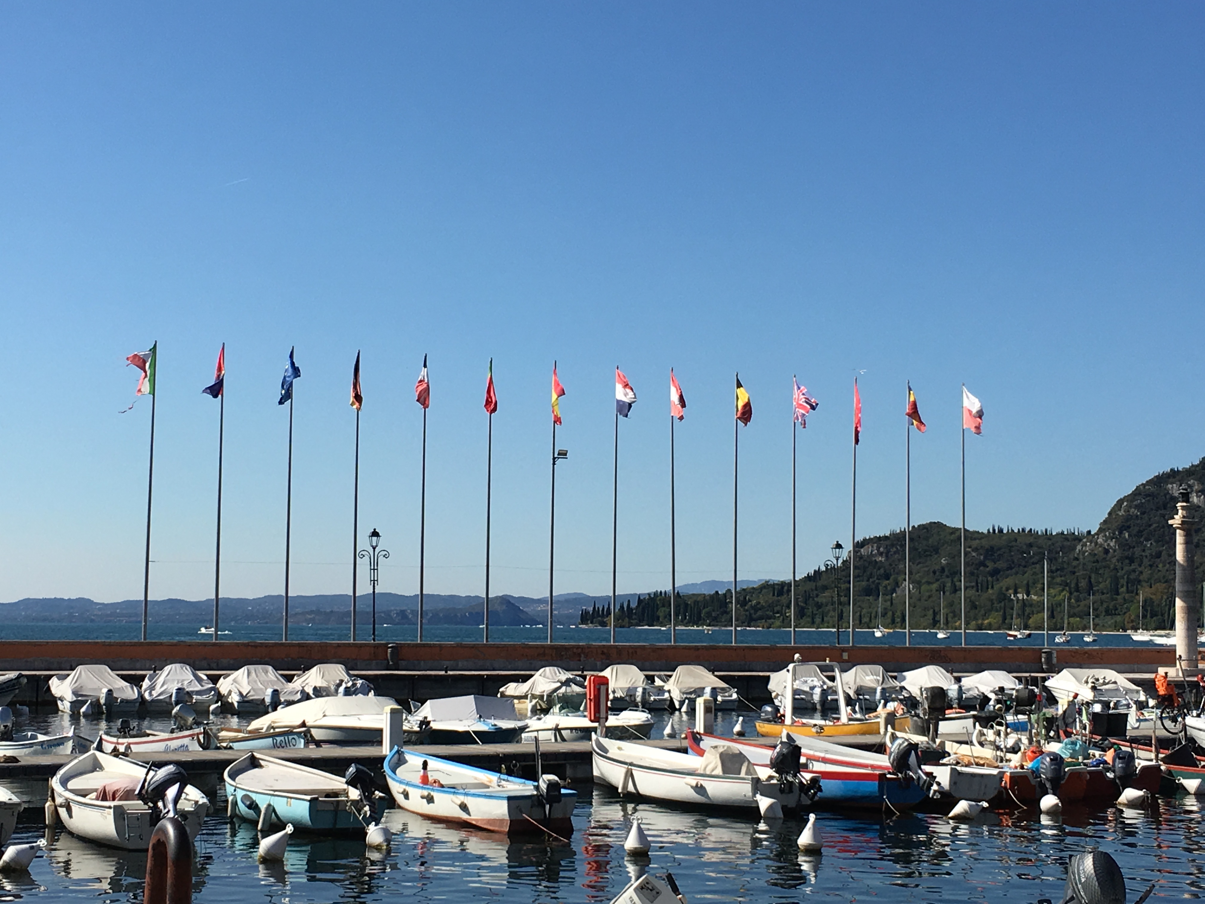 Fourteen flags flying by the seaside