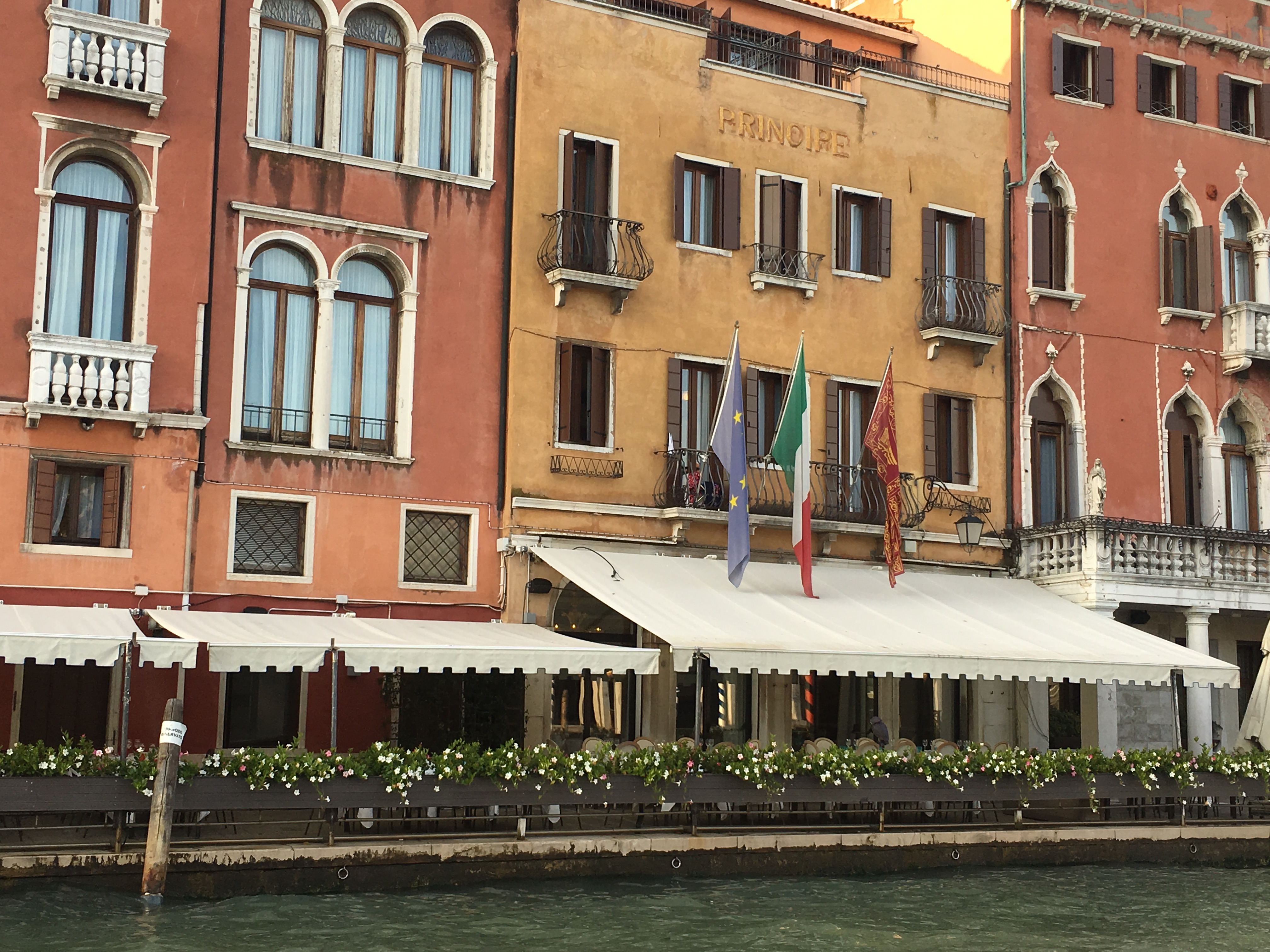 Three flags outside a building