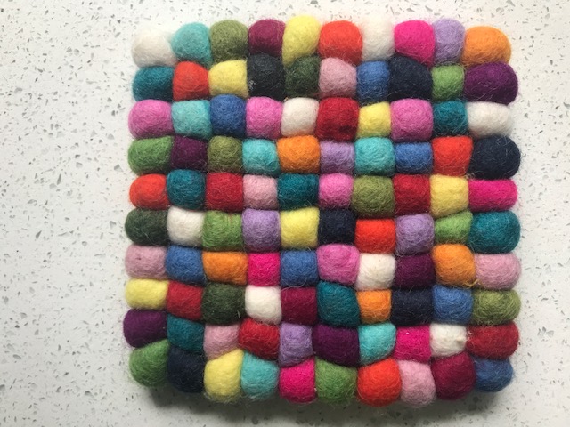 A group of multi-coloured felt bobbles