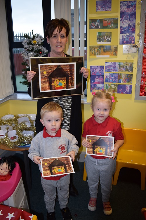 Pupils from Omagh County PS nursery unit with their winning design, pictured with Mrs MacCrossan