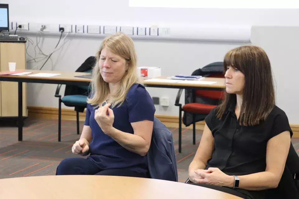 Sign language interpreters during event discussion