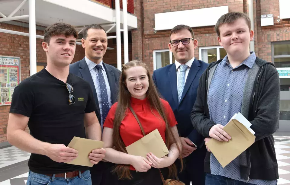 Banbridge Academy students celebrating results with Principal and CCEA Chief Executive
