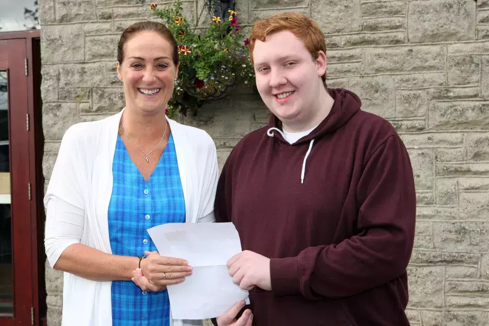 Pupil celebrating results with Dr Michelle Rainey, Principal of Ballyclare High School