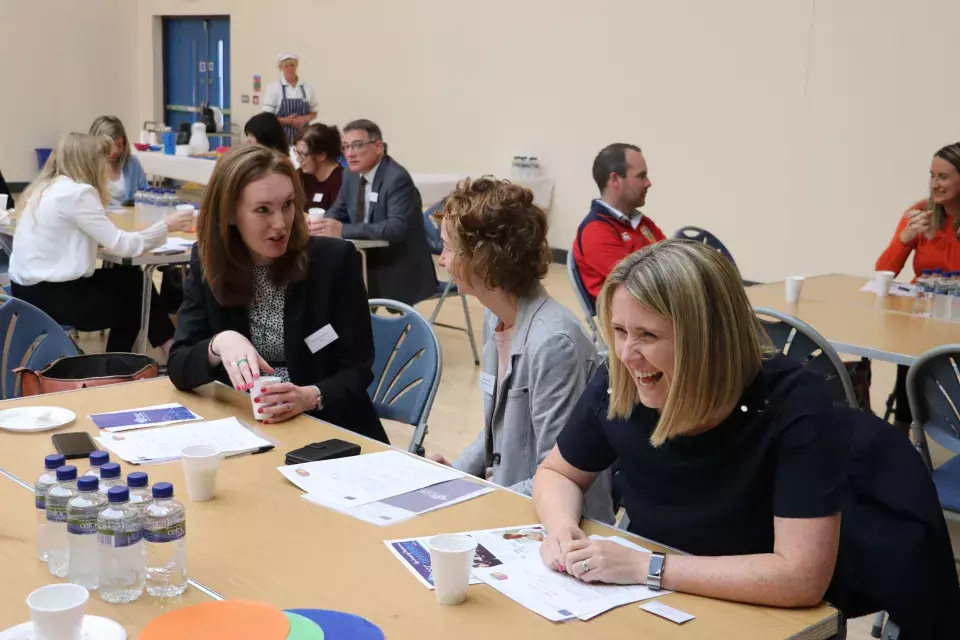 Conference participants at table - final