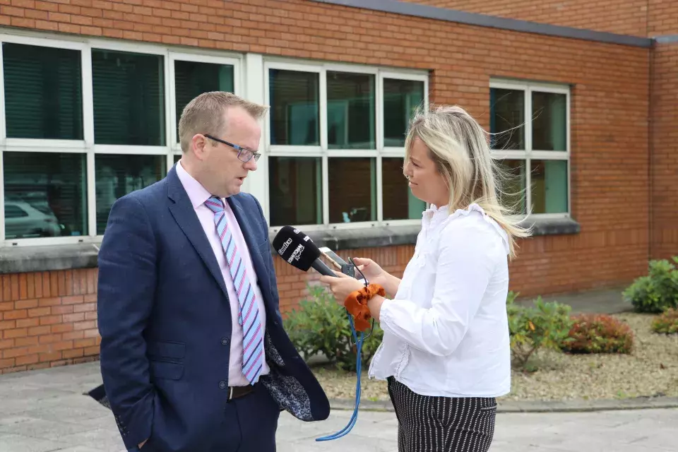 Mr Carville, Regent House Headmaster, speaking with Cool FM reporter Sasha Wylie