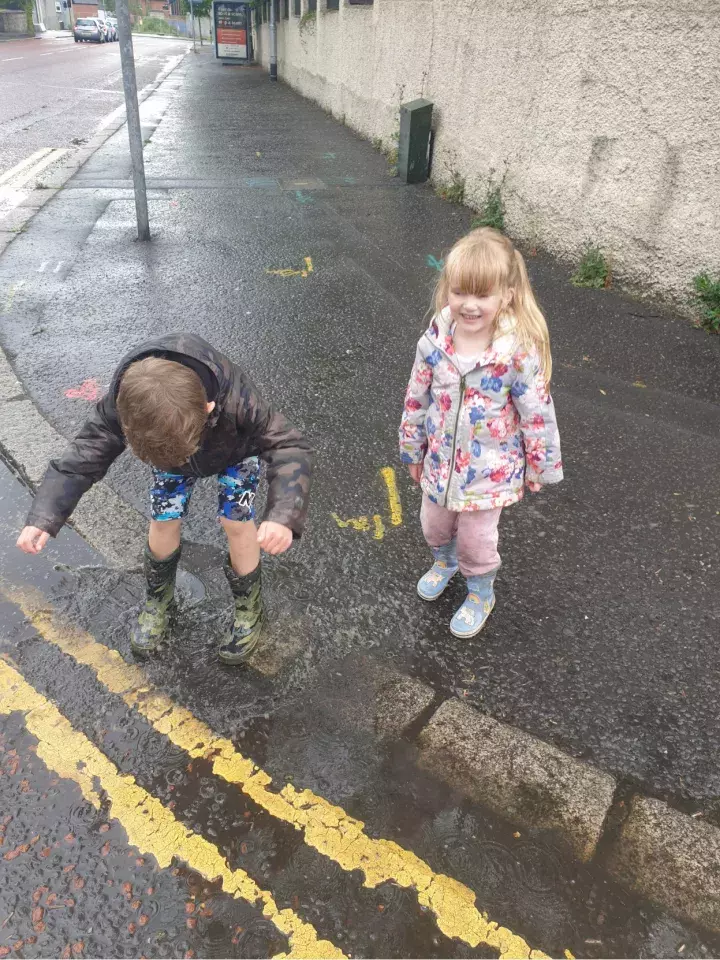 Dundela Infants' School and Nursery Unit splashing in puddles