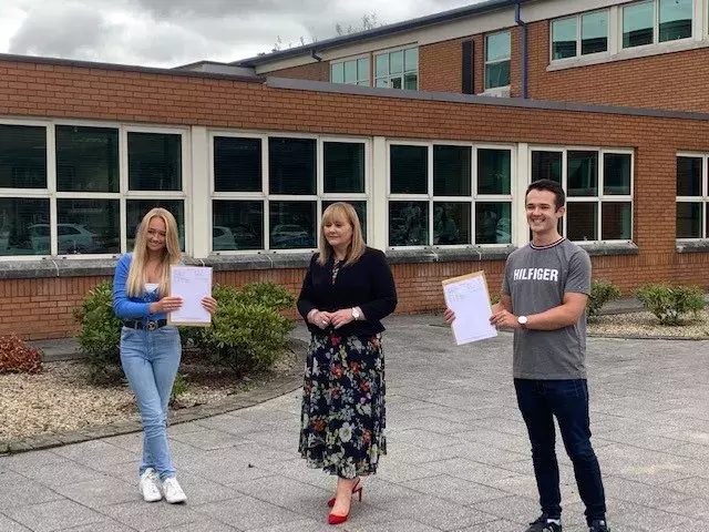 Regent House School Head girl and Head Boy with Education Minister Michelle McIlveen