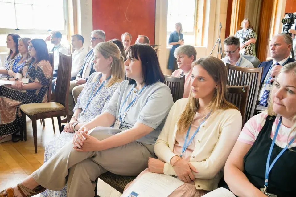 Audience image of persons seated