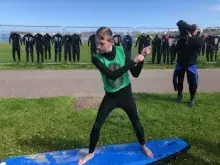 Pupil from Ardnashee School and College practicing surf therapy