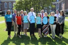 CSSC staff with fundraising total for Cancer Focus