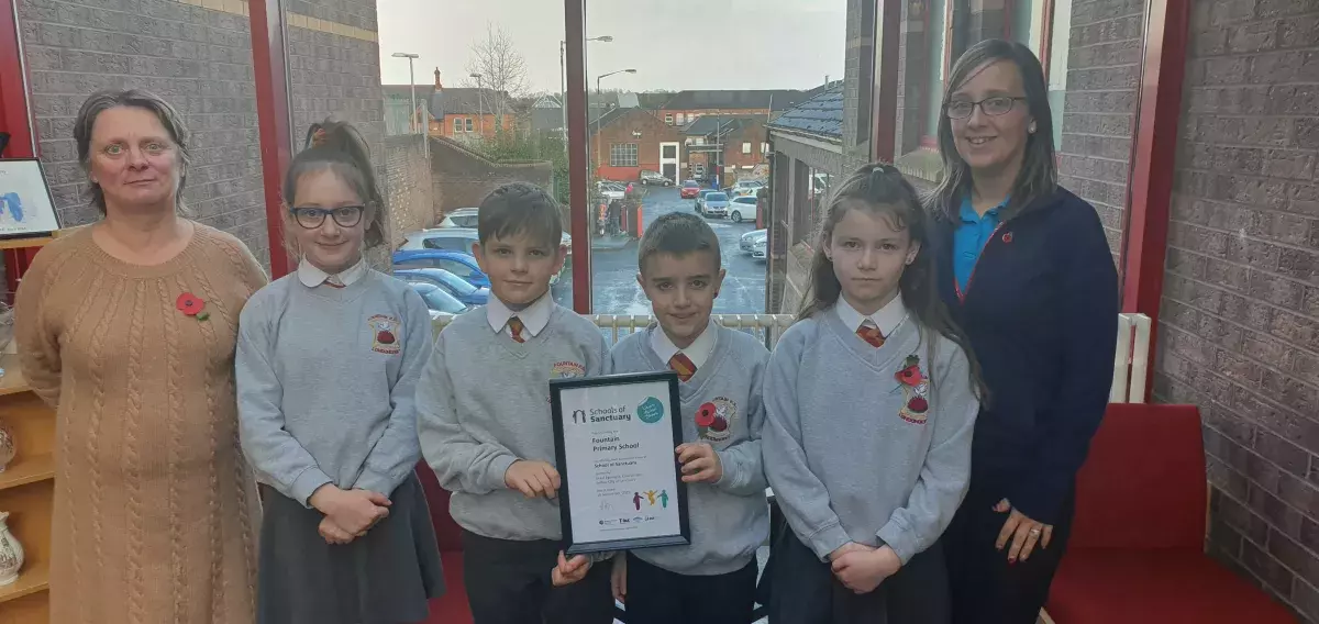 Pupils and staff from Fountain Primary School with School of Sanctuary award
