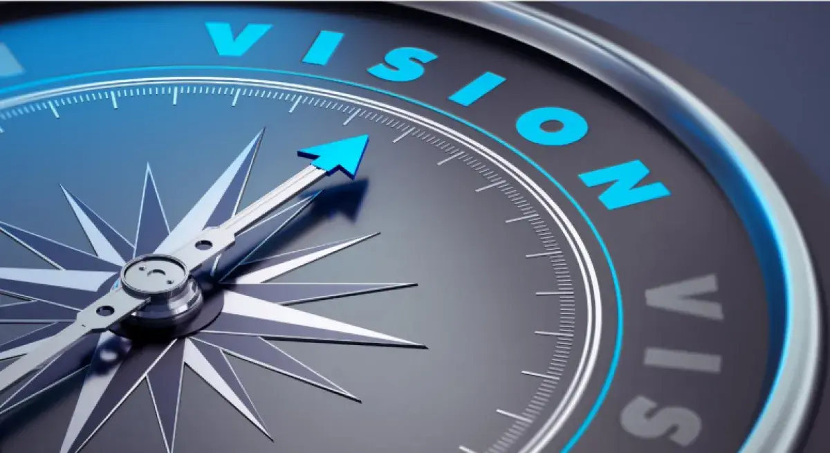 Image of a compass with the word vision written in blue