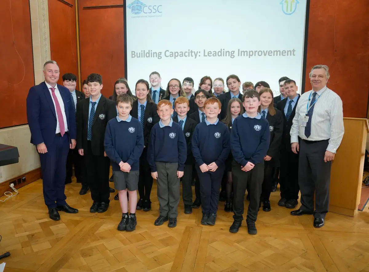 Paul Givan, Education Minister, Thornfield House School choir and Mark Baker, Chief Executive, CSSC