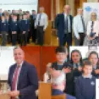 Left to right  Photo (1) Paul Givan, Education Minister; Thornfield House Special School and Mark Baker, Chief Executive, CSSC. Photo (2) Peter Martin MLA; Mark Baker, Chief Executive, CSSC; Jayne Millar, Head of Education Support, CSSC; David Brooks MLA and David Malcom, Permanent Secretary, Department of Education. Photo (3)  Emma Hylands, Principal, Clare Primary School being presented an award by Paul Givan, Education Minister. Photo (4) Close up of pupils from Thornfield House Special School choir. 
